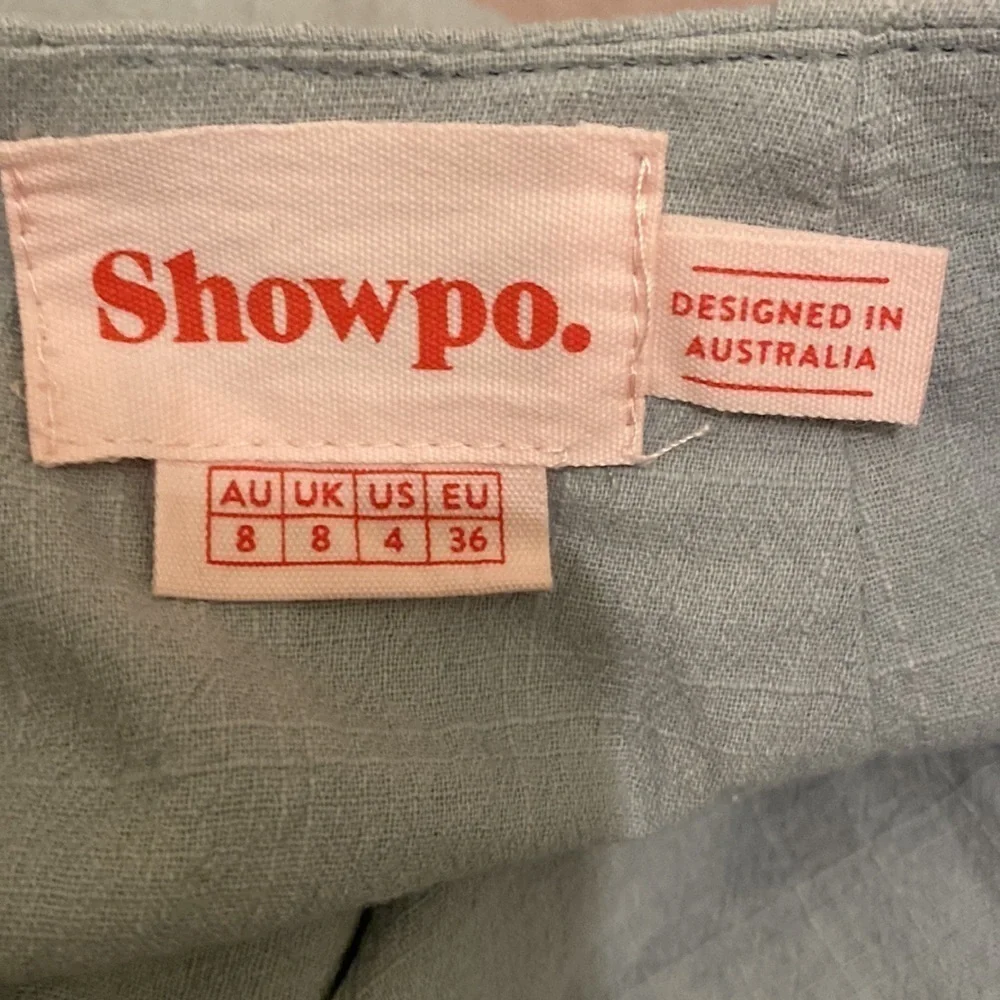 Showpo mint blue cotton mini wrap skirt .Size 4